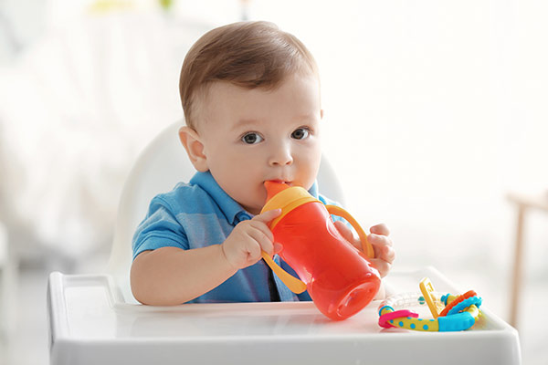 Child drinking from a sippy cup