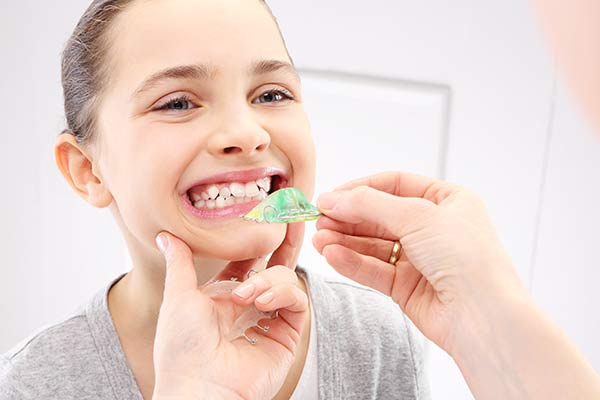 Young girl being fitted for a retainer due to orthodontic issues