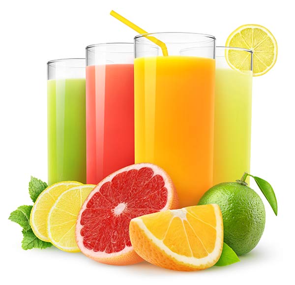 Assortment of citrus drinks in glasses behind sliced citrus fruits