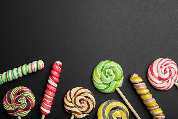 Assorted lollipops laying on a table