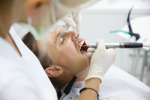 Patient being examined for periodontal disease