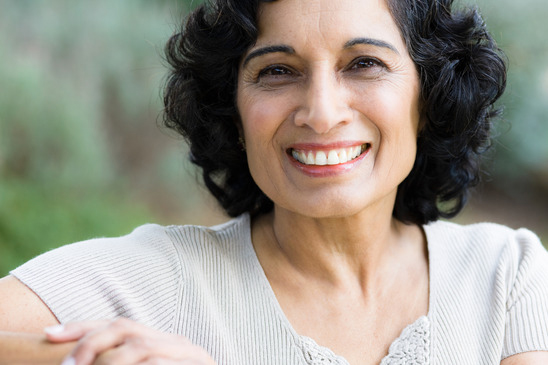 smiling woman with acp toothpaste